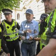 Sean Clerkin is arrested in Glasgow's Nelson Mandela Place friday after displaying a banner with the words Palestine and Action. STYPic Gordon Terris /Herald & Times18/7/25